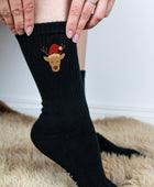 Socken mit Rentier und Weihnachtsmütze